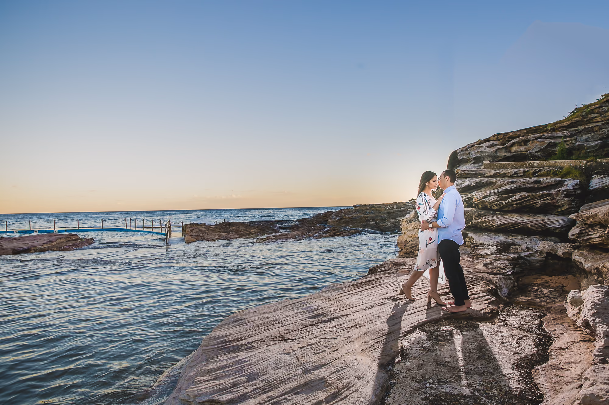 A bride and groom held in low light in the Sydney city laneways